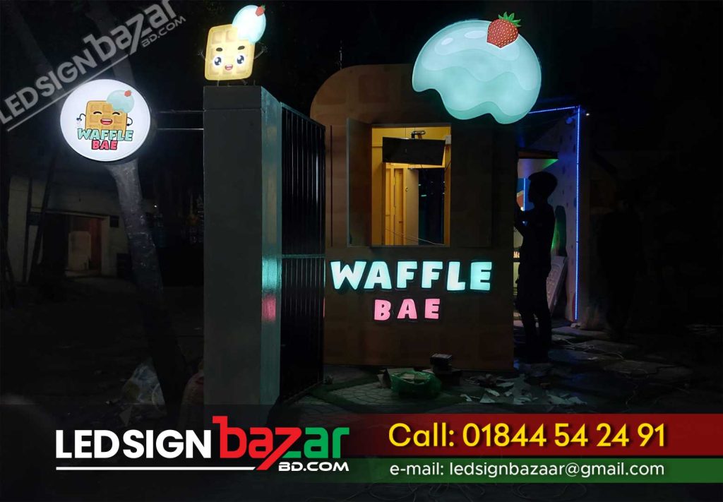 The credit for WAFFLE BAE's remarkable branding goes to LED SignBazarBD, a leading signage and branding company in Dhaka. The creative team at LED SignBazarBD worked closely with the restaurant's founders to design and install eye-catching Neon Signage and Sticker Branding. These elements contribute to WAFFLE BAE's unique identity and create a memorable impression on customers. LED SignBazarBD Service Product Item: Best signage company, house name plate ideas, raised acrylic letters, nameplate design for home, modern house name plate design, signboard near me, design house name, gersaint's signboard, Cocktail Glass Neon Signs LED Lights usb acrylic Cool, ''Honey '' Real Glass Acrylic Panel Handmade Visual, Original Glass Neon Lighting, Neon Box Sign, Glass Neon Sign - Black Acrylic, Wholesale glass sign And Luminescent EL Products, Acrylic Neon Sign, Cocktail Glass Neon Signs Led Lights Usb Acrylic Cool, LED Glass Restaurant Acrylic Neon Sign Board, Records Neon Sign Light Acrylic Box Handcraft Art Real, You Need is Love Acrylic Glass Art with real Neon LED Sign, Neon Signs: how they work and what you need to know, Custom Neon Sign, Wine Glass Neon Lights Neon Sign For Wall Decoration, Custom Led Neon Sign & Customized Acrylic Led Lighting,