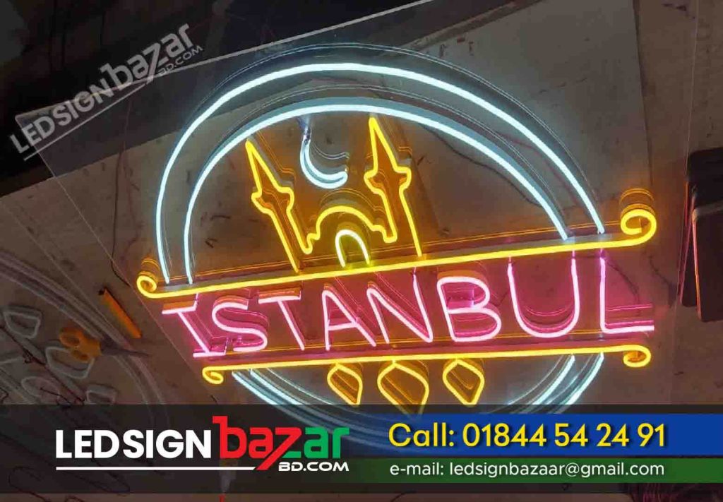 Project Name: Istanbul LED Neon Sign Project Types: Restaurant Neon Sign, Café, Bar Neon Sign Board Design, and Maker in Bangladesh. Sign Board Labor: We have 100+ sign board fitting laborers, If you need any sign board labor, you can hire a laborer from LED Sign Bazar. Project Location: Near Dhaka University Project Materials: neon tube, neon letter, neon round bell sign board, leading sign board design and making company in Bangladesh.